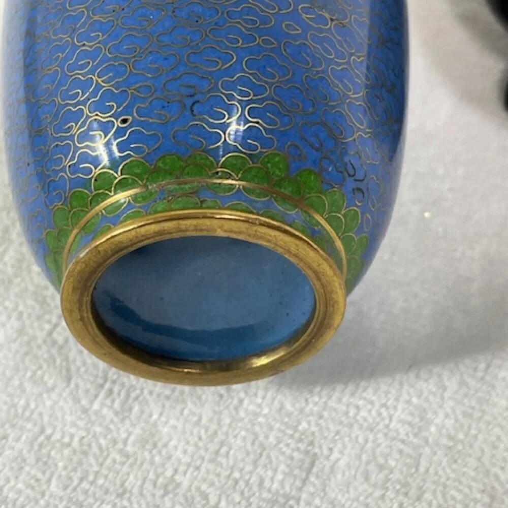Chinese blue cloisonne and brass vase with wooden stand.